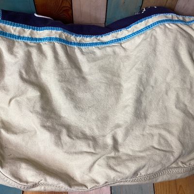 Sale Photo Thumbnail #507: Vintage Victoria's Secret PINK canvas messenger shoulder bag in cream, navy, and teal accents. Features Y2K style embroidered graphics, felt patches ('Live in 86 Pink'), appliqué detailing, multiple interior snap-in zip pouches, and an adjustable shoulde