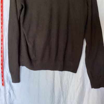 Sale Photo Thumbnail #400: Banana Republic men's long-sleeve V-neck sweater in dark brown/black. Made from 100% extra fine merino wool. Size Small. Features ribbed cuffs and hem. Measures approximately 26 inches in length from shoulder to hem. Good pre-owned condition with light si