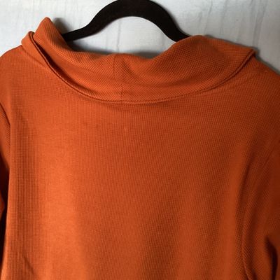 Sale Photo Thumbnail #474: Women's long sleeve cowl neck knit top by D&Co. Essentials in burnt orange. Features a waffle knit texture. Size US 1X  Made in Vietnam. Measures approximately 28 inches in length. In good condition with no visible tears or major stains.