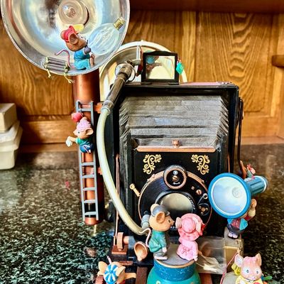 Sale Photo Thumbnail #154: Charming vintage-style collectible figurine featuring whimsical mice operating a large, detailed antique bellows camera with a flash attachment.