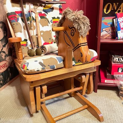 Sale Photo Thumbnail #192: Vintage wooden glider rocking horse chair with a teddy bear patterned cushion and yarn mane.