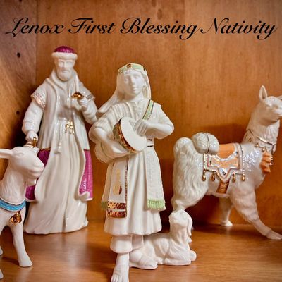 Sale Photo Thumbnail #70: Lenox First Blessing Nativity porcelain figurines, featuring a drummer boy, a wise man, a llama, and other animals with gold and colored accents.