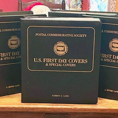 Sale Photo Thumbnail #156: Collection of Postal Commemorative Society U.S. First Day Covers & Special Covers albums, featuring dark green binders with gold lettering.
