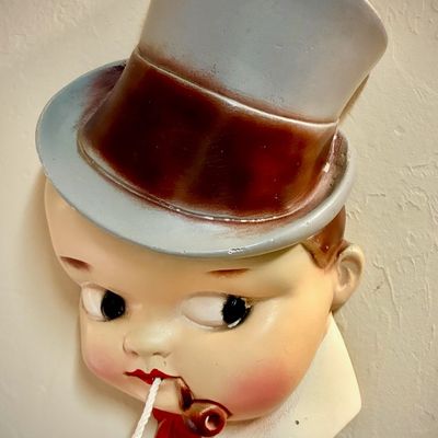 Sale Photo Thumbnail #100: Vintage ceramic string holder depicting a boy in a top hat with a pipe, featuring hand-painted details.
