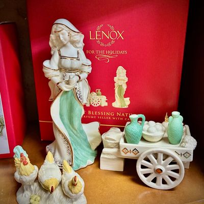 Sale Photo Thumbnail #143: Lenox "First Blessing Nativity" perfume seller figurine with cart and a separate chicken figurine, shown with original red box.
