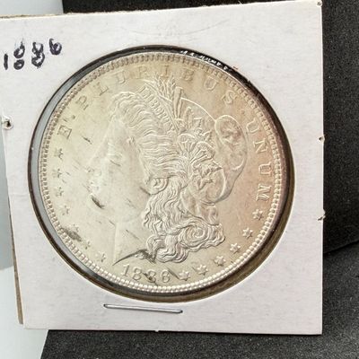 LOT 107: 1886 Morgan Silver Dollar