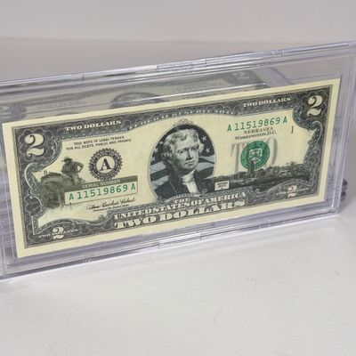 LOT 33: Collection of Ten Vintage $2 Bills with Aftermarket Art Depicting U.S. States in Cases - Ohio, Vermont, Indiana and More