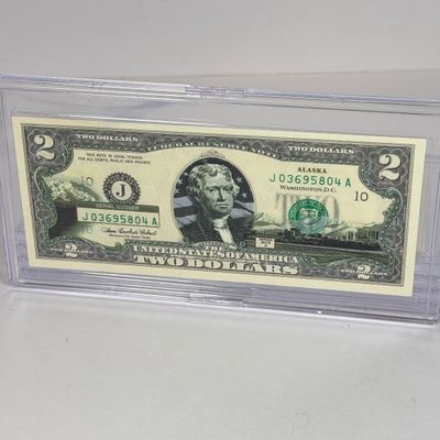 LOT 34: Collection of Ten Vintage $2 Bills with Aftermarket Art Depicting U.S. States in Cases - Florida, Alaska, New Jersey and More