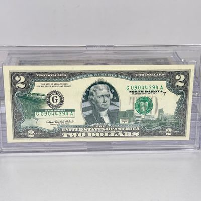 LOT 31: Collection of Ten Vintage $2 Bills with Aftermarket Art Depicting U.S. States in Cases - Maine, Texas, New Mexico and More