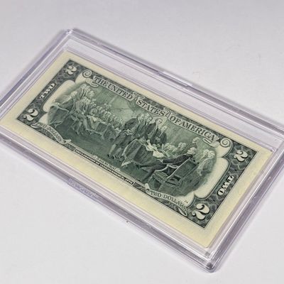 LOT 31: Collection of Ten Vintage $2 Bills with Aftermarket Art Depicting U.S. States in Cases - Maine, Texas, New Mexico and More