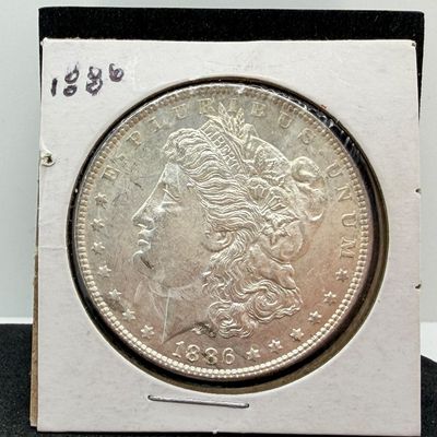 LOT 107: 1886 Morgan Silver Dollar