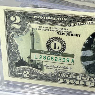 LOT 34: Collection of Ten Vintage $2 Bills with Aftermarket Art Depicting U.S. States in Cases - Florida, Alaska, New Jersey and More
