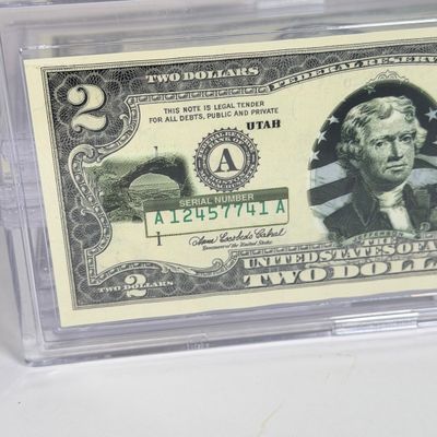 LOT 33: Collection of Ten Vintage $2 Bills with Aftermarket Art Depicting U.S. States in Cases - Ohio, Vermont, Indiana and More