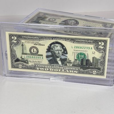 LOT 34: Collection of Ten Vintage $2 Bills with Aftermarket Art Depicting U.S. States in Cases - Florida, Alaska, New Jersey and More