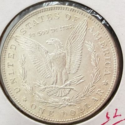LOT 107: 1886 Morgan Silver Dollar