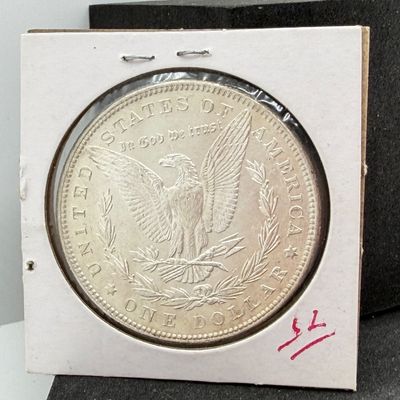LOT 107: 1886 Morgan Silver Dollar