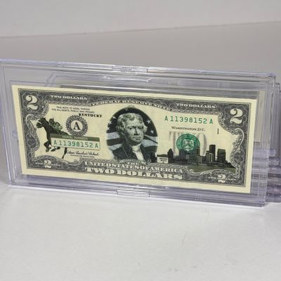 LOT 34: Collection of Ten Vintage $2 Bills with Aftermarket Art Depicting U.S. States in Cases - Florida, Alaska, New Jersey and More