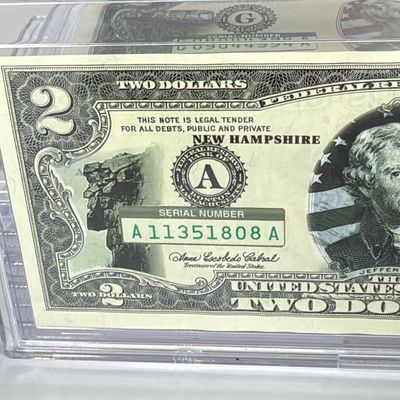 LOT 31: Collection of Ten Vintage $2 Bills with Aftermarket Art Depicting U.S. States in Cases - Maine, Texas, New Mexico and More