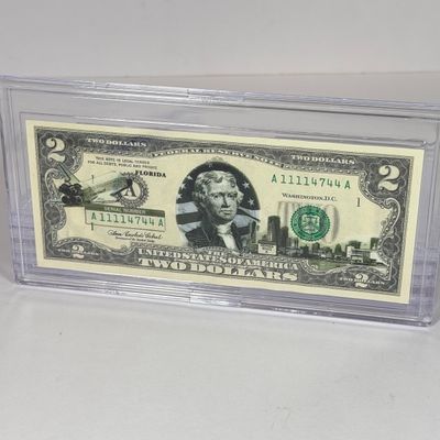 LOT 34: Collection of Ten Vintage $2 Bills with Aftermarket Art Depicting U.S. States in Cases - Florida, Alaska, New Jersey and More
