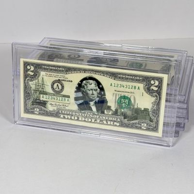 LOT 34: Collection of Ten Vintage $2 Bills with Aftermarket Art Depicting U.S. States in Cases - Florida, Alaska, New Jersey and More