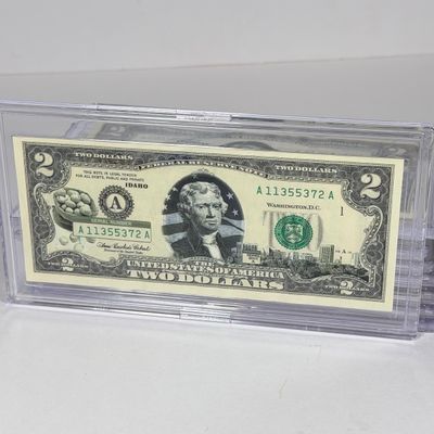 LOT 34: Collection of Ten Vintage $2 Bills with Aftermarket Art Depicting U.S. States in Cases - Florida, Alaska, New Jersey and More