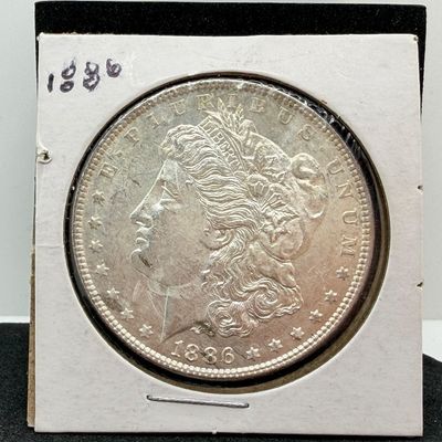 LOT 107: 1886 Morgan Silver Dollar