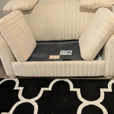 Sale Photo Thumbnail #36: Cream-colored striped sleeper sofa with matching throw pillows, showing the mattress deck underneath the seat cushions.