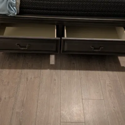 Sale Photo Thumbnail #75: Dark wood platform bed frame featuring two built-in under-bed storage drawers with metal pull handles.