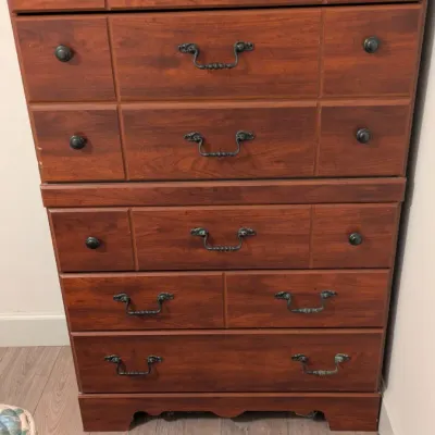Sale Photo Thumbnail #32: Vintage cherry wood chest-on-chest dresser featuring a mix of bail pulls and round knobs, with a bracket foot base.