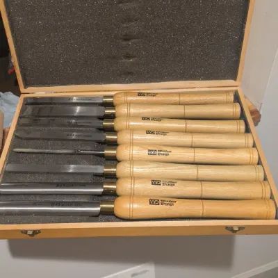 Sale Photo Thumbnail #39: Windsor Design eight-piece high-speed steel wood lathe chisel set, housed in its original foam-lined wooden storage case.