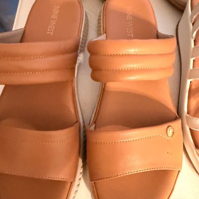 Sale Photo Thumbnail #40: Pair of Nine West tan leather slide sandals featuring a quilted instep strap and a platform sole.