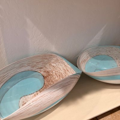 Sale Photo Thumbnail #120: Pair of contemporary art glass bowls featuring a textured, wood-grain pattern in brown and white with vibrant turquoise blue accents.