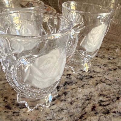 Sale Photo Thumbnail #82: Vintage clear pressed glass mugs featuring a frosted rose design and scalloped pedestal bases.
