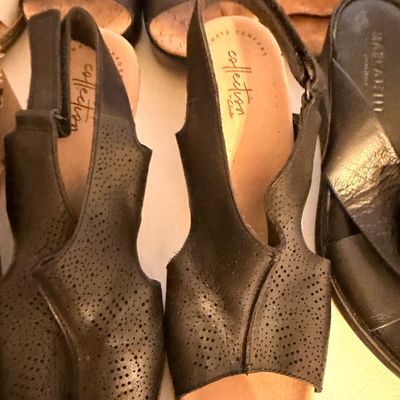 Sale Photo Thumbnail #38: Collection by Clarks black leather slingback sandals with perforated detailing and cork-style soles, shown alongside other women's sandals.