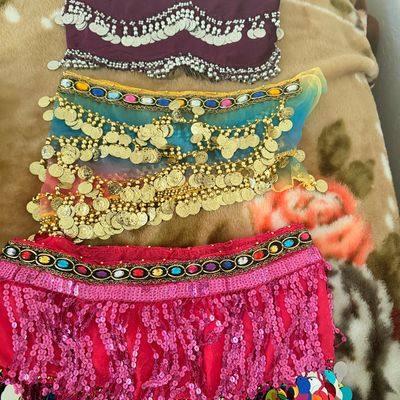 Sale Photo Thumbnail #110: Three belly dancing hip scarves, including a purple velvet scarf with silver coins, a blue and yellow mesh scarf with gold coins, and a pink sequined scarf with colorful paillettes.