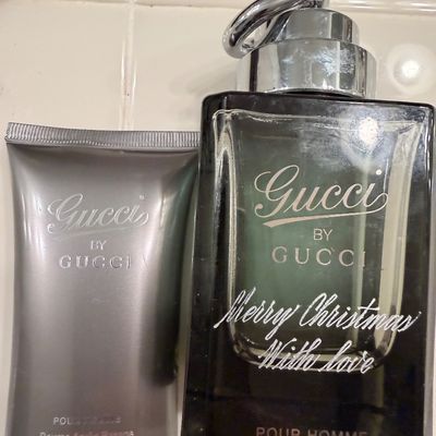 Sale Photo Thumbnail #47: Gucci by Gucci Pour Homme fragrance set, featuring a 75ml after shave balm tube and a glass cologne bottle with a silver-tone horsebit cap.