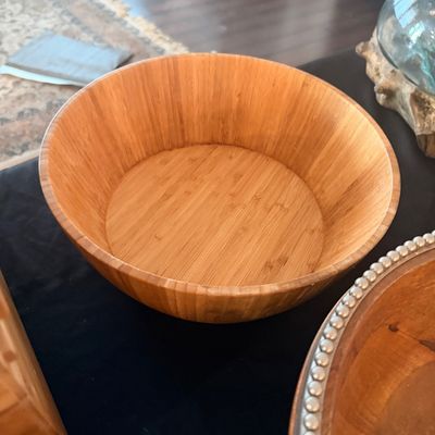 Sale Photo Thumbnail #129: Large round bamboo serving bowl with a natural finish, showing vertical stave construction.