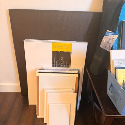 Sale Photo Thumbnail #111: Assortment of blank artist canvases in various sizes, including a Master's Touch Classic Collection canvas, alongside a packaged Integra folding easel.