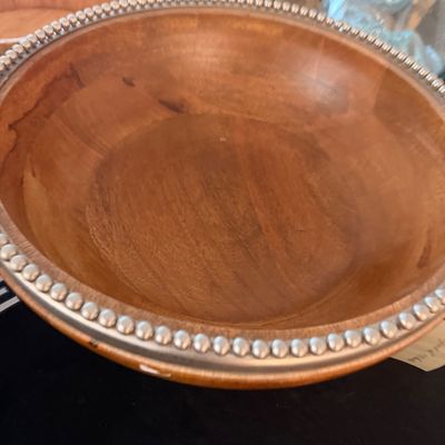 Sale Photo Thumbnail #130: Large wooden serving bowl featuring a decorative beaded metal rim.