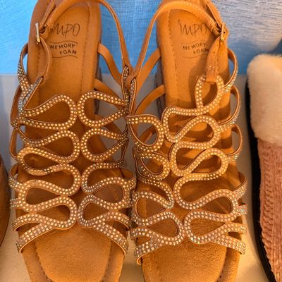 Sale Photo Thumbnail #36: Pair of Impo memory foam wedge sandals featuring tan straps adorned with rhinestones in a swirling pattern.
