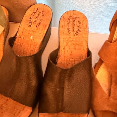 Sale Photo Thumbnail #34: Pair of Kork-Ease black leather slide sandals with cork wedge soles, showing light wear.