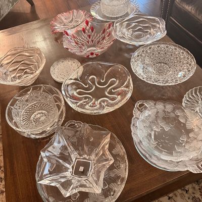Sale Photo Thumbnail #88: Collection of vintage clear and cut glass serving bowls and platters, including a bowl with red accents and various textured patterns.