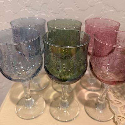 Sale Photo Thumbnail #123: Set of six vintage pastel-colored wine glasses, featuring two blue, two green, and two pink glasses with etched scrollwork patterns.