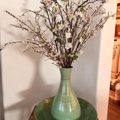 Sale Photo Thumbnail #63: Ceramic vase and matching wide bowl in a green glazed finish, styled with faux white blossom branches.
