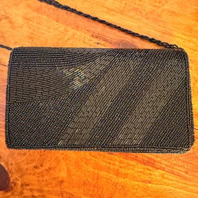 Sale Photo Thumbnail #30: Vintage black beaded evening clutch with a matching beaded shoulder strap, featuring intricate geometric patterns of seed and bugle beads.