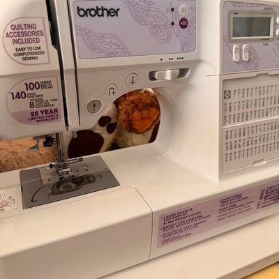 Sale Photo Thumbnail #7: Brother computerized sewing and quilting machine featuring 100 built-in stitches and an LCD display screen.
