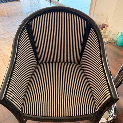Sale Photo Thumbnail #66: Postmodern barrel-back armchair featuring a glossy black frame and black-and-white striped upholstery.