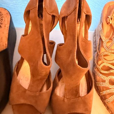 Sale Photo Thumbnail #35: Pair of brown suede peep-toe heeled sandals with cutout details and rear zipper closures.