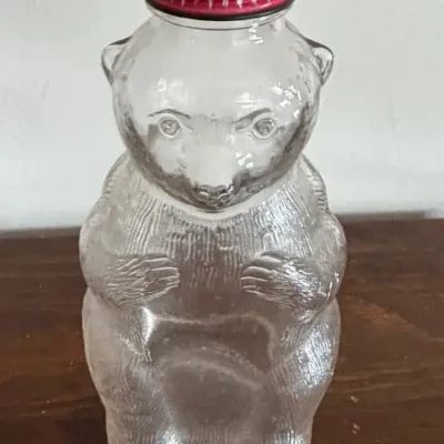 MCM Vintage Snow Crest Beverages Clear Glass Bear Coin Bank Bottle with Lid
