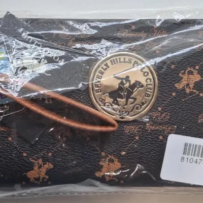 Beverly Hills Polo Club zip-around wristlet wallet in brown monogram faux leather, new in original plastic packaging with a gold-tone...